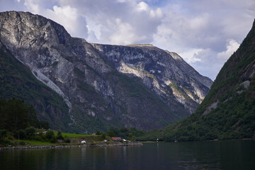Landscape picture of Aurlandsfjorden fjord in norwegian region Aurland in calm summer evening. Beautiful place with clean nature, high mountains and deep walley, pefect to spend active summer holiday.