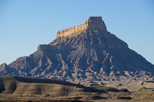 The landscape in Southern Utah is one of the most unique and otherworldly scenes in the United States. Pictured here is the Factory Butte, a notable landform in the area.