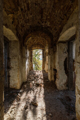 Fototapeta premium Vaulted corridor of old abandoned prison
