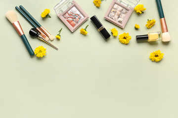 Composition with makeup products and beautiful chrysanthemum flowers on beige background