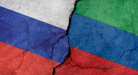 Flags of Russia and Dagestan, texture of concrete wall with cracks, grunge background, military conflict concept