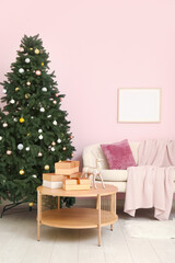 Interior of living room with sofa, table and Christmas tree