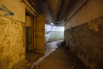 Old vaulted corridor of Soviet bunker, echo of Cold War