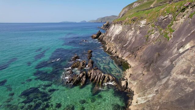 IRELAND- 8.27.2023 -Excellent aerial footage moving along the rocky cliffside of DIngle, Ireland.