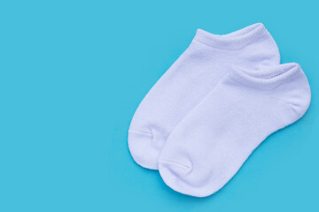 White socks on blue background.