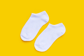 White socks on yellow background.