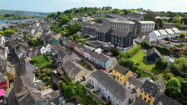 CORK- 8.27.2023 -Excellent aerial footage moving across rooftops of colorful buildings in Kinsale, Ireland.