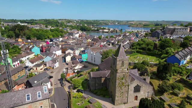 CORK- 8.27.2023 -Excellent aerial footage circling the town of Kinsale, Ireland with a cathedral as the focal point.