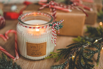 Candle and New Year's gifts, Christmas mood