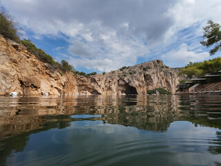 Fototapeta na wymiar Mineral lake Vouliagmeni in Greece.