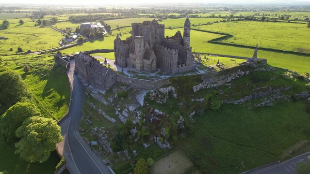 IRELAND- 8.27.2023 -Excellent aerial footage moving over the shadowy Rock of Cashel in Ireland.