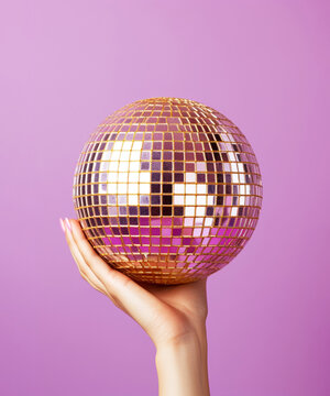 hand holding giant disco ball on lilac background. Season greetings concept. Generative AI