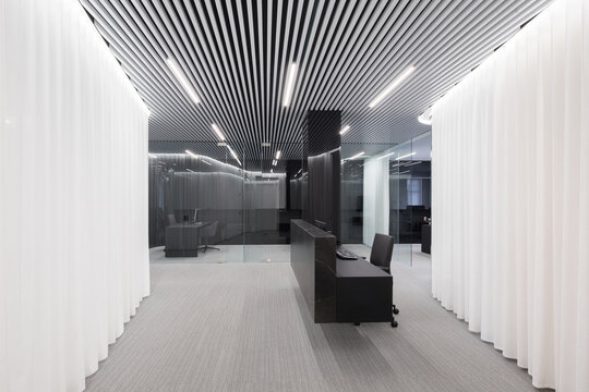 Modern office with striped ceiling design