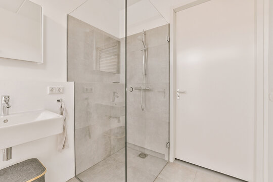 Bathroom with shower cabin and sink with mirror
