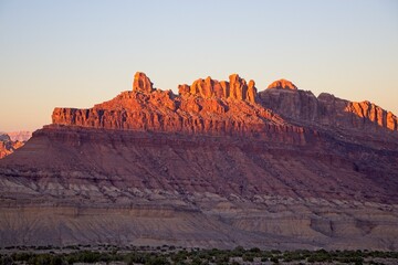 Interstate 70 winds through the San Rafael Swell, a high desert region of unique landforms like mesas and buttes and pastures on top - obrazy, fototapety, plakaty