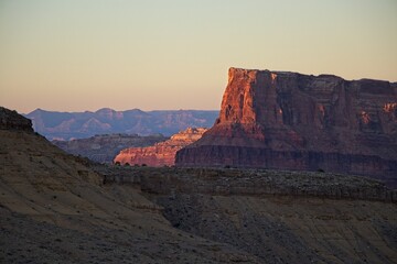 Interstate 70 winds through the San Rafael Swell, a high desert region of unique landforms like mesas and buttes and pastures on top