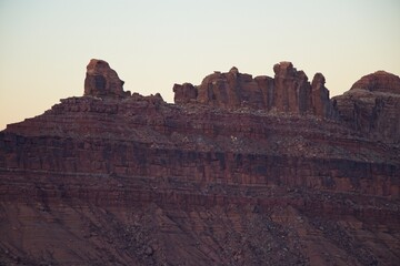 Interstate 70 winds through the San Rafael Swell, a high desert region of unique landforms like mesas and buttes and pastures on top