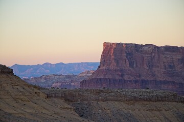 Interstate 70 winds through the San Rafael Swell, a high desert region of unique landforms like mesas and buttes and pastures on top