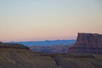 Interstate 70 winds through the San Rafael Swell, a high desert region of unique landforms like mesas and buttes and pastures on top