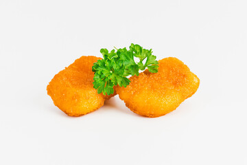 Breaded Chicken Inner Fillet on a White Background,Chicken Breaded Raw Meat.Chicken Breaded Fillet.Fast food. Fast cooking. Breaded chicken nuggets. Homemade food at home.