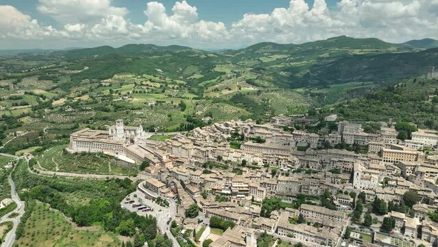 ITALY - AUGUST.9.2023 - Excellent aerial footage circling the Basilica of Saint Francis of Assisi in Assisi, Italy.