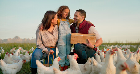 Parents, girl and hug with chicken, farm and happy with box for food, sustainability and talk in...