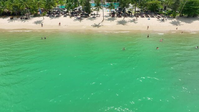 Aerial view of Khao Saba Beach with the blue-green sea and tourists having fun playing in the sea.Phang Nga Thailand