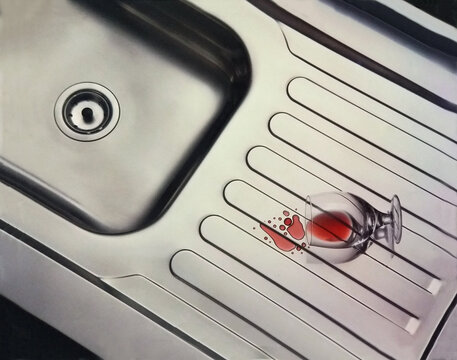 Sink top with spilled glass of red wine.