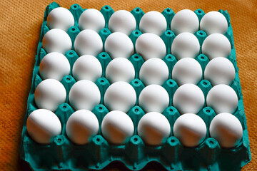 white eggs in box for sale or food preparation
