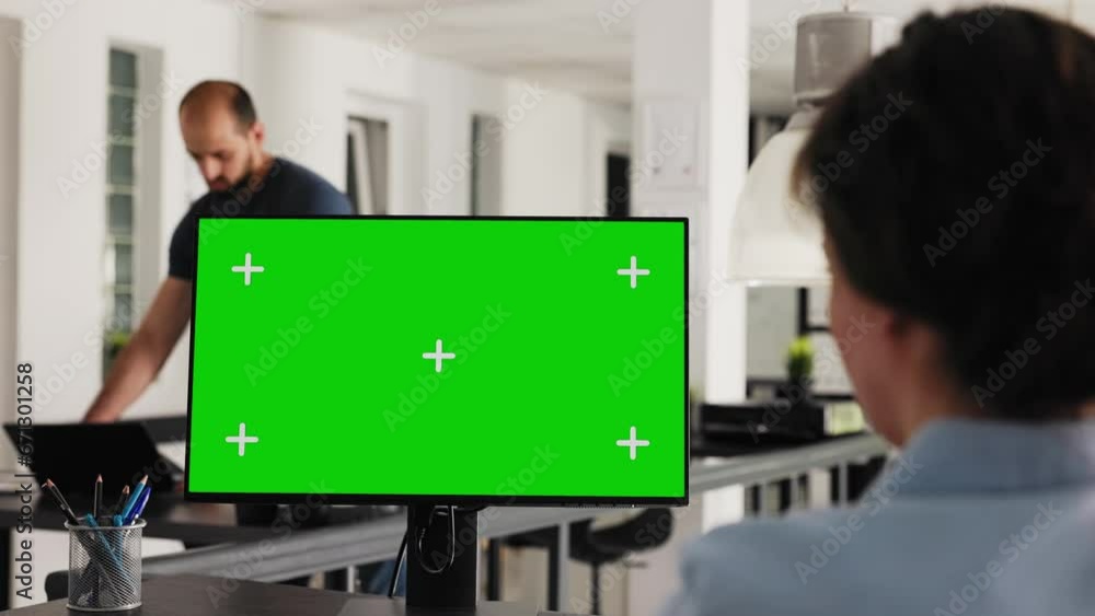 Poster office manager uses greenscreen on pc and working with isolated monitor display for business develop