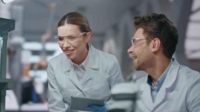 Partners working science laboratory looking computer closeup. Smiling researcher