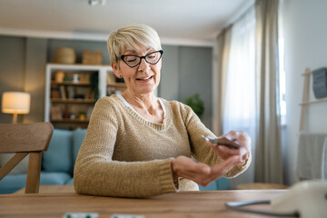 One senior caucasian woman take medicine drugs or supplement vitamin