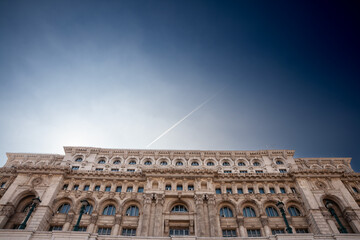 Obraz premium Panorama of the Romanian palace of parliament in Bucharest, symbol of romanian communism, also called Casa Poporului, seen from below in Bucharest, Romania.