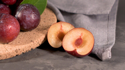 Red plums in a cork plate