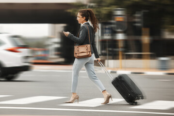 Business travel, phone and woman with luggage in city street for location, search or texting. Smartphone, app and blur with suitcase in New York online for fast transport, taxi or service request