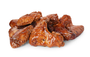 Pile of chicken wings glazed with soy sauce isolated on white