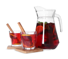 Jug and glasses with tasty punch drink isolated on white