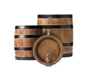 Set of many wooden barrels on white background