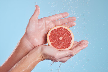 Hands, water splash and grapefruit cosmetic skincare for vitamin c nutrition, citrus health...