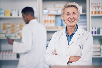 Woman, portrait and pharmacist smile with arms crossed for medical services, medicine advice and healthcare support. Mature female manager working with pride in retail drugstore, pharmacy and shop - obrazy, fototapety, plakaty