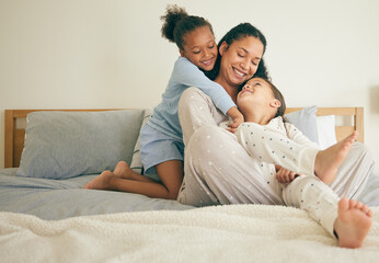 Mother, bed and children hug or happy with parent together in the morning laughing in a bedroom in a home. Funny, bonding and mom enjoy quality time with kids or girls with happiness and love - obrazy, fototapety, plakaty