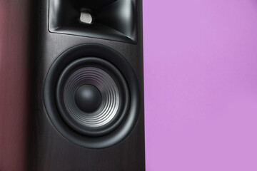 One wooden sound speaker on color background, closeup. Space for text