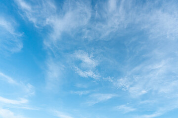 Beautiful blue sky with strange shape of clouds in the morning or evening used as natural background texture in decorative art work.