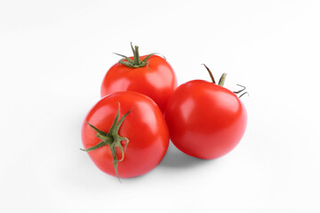 Fresh ripe red tomatoes on white background