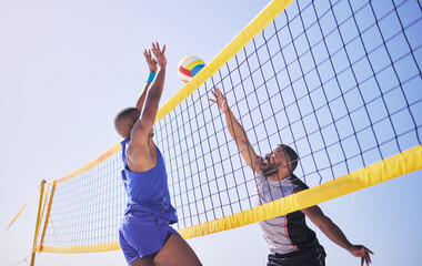 Jump, hit and beach, volleyball and men at net with sports action, fun and summer competition with blue sky. Energy, ocean games and volley challenge with athlete hitting ball for goal in nature. - obrazy, fototapety, plakaty