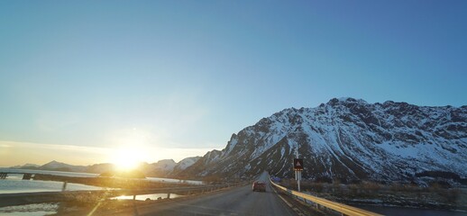 A road with snow mountain during winter season. 