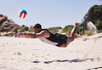 Beach, energy and man jump volleyball while playing on the sand with action on holiday. Fitness...