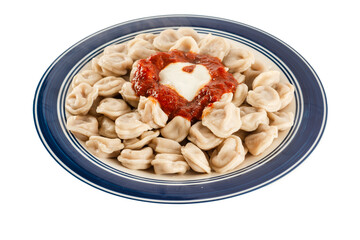 Special Turkish and Middle East dish made by placing small meat pieces in the dough and served with yogurt and tomato paste sauces after cooking.