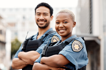 Happy police, team and arms crossed in confidence for city protection, law enforcement or crime. Portrait of man and woman officer standing ready for justice, security or teamwork in an urban town - obrazy, fototapety, plakaty