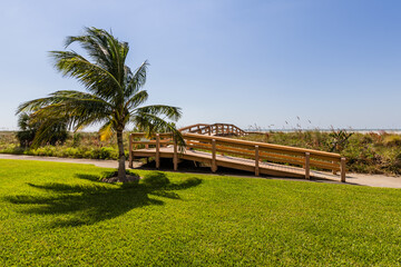 Fototapeta premium Boardwalk Marco Island Florida Green Grass Blue Sky